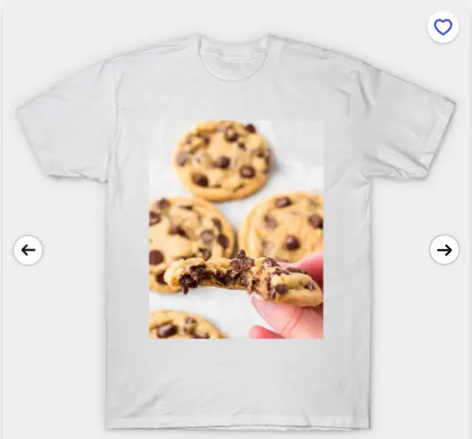 White T-shirt featuring a close-up of chocolate chip cookies with a bitten cookie held in hand in the foreground.