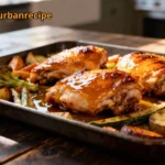 Sheet Pan Honey Chicken roasted with vegetables on a baking tray, golden and glossy.