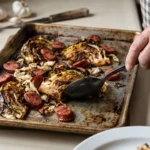 A professional chef using a preheated pan to create a Crispy Sheet Pan Cabbage and Sausage with charred edges.