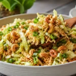 Crunchy Cashew Ramen Salad made with crisp green cabbage, toasted ramen noodles, roasted cashews, green onions, and a homemade sesame dressing, perfect for potlucks and summer gatherings.