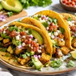 Roasted zucchini tacos filled with caramelized zucchini, creamy avocado, cotija cheese, fresh salsa, cilantro, and lime in warm corn tortillas for a healthy vegetarian weeknight dinner.